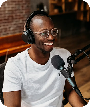 Person smiling with headphones and mic